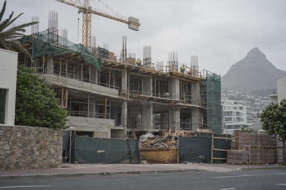 A concrete frame under construction below Lion’s Head